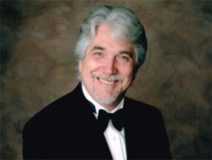 Image of Roger Held, pianist, piano tuner, and teacher.